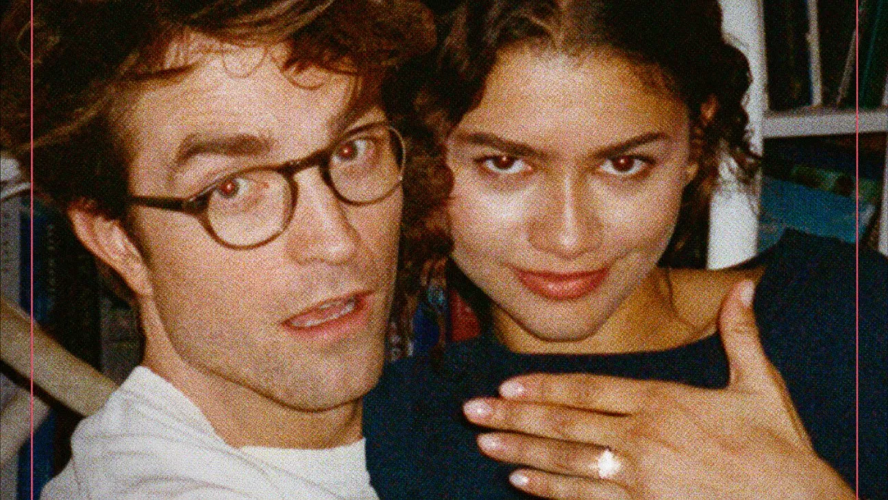 Zoomed-in cover image from the movie The Drama featuring Emma Harwood, played by Zendaya, and Charlie Thompson, played by Robert Pattinson, posing closely together